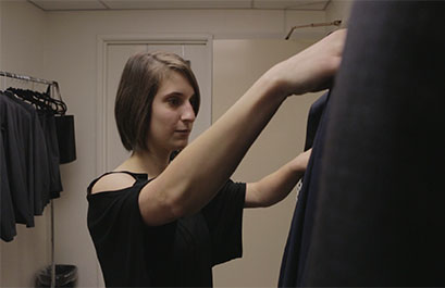 UH student Alexandra D'Amico looks at suits available for rental through Career Closet UH student Alexandra D'Amico looks at suits available for rental through Career Closet